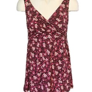 Catalina suddenly slim swim dress and a 1 X. Pink flowers on black background.